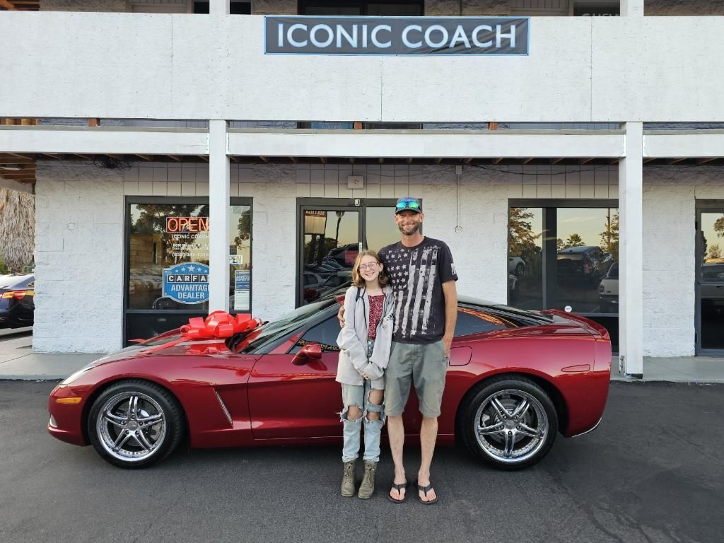 A customer picking up a Corvette