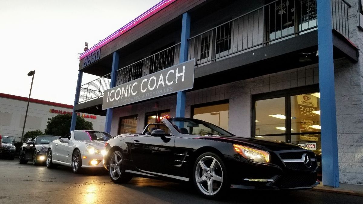 Iconic Coach on Miramar Road at dusk